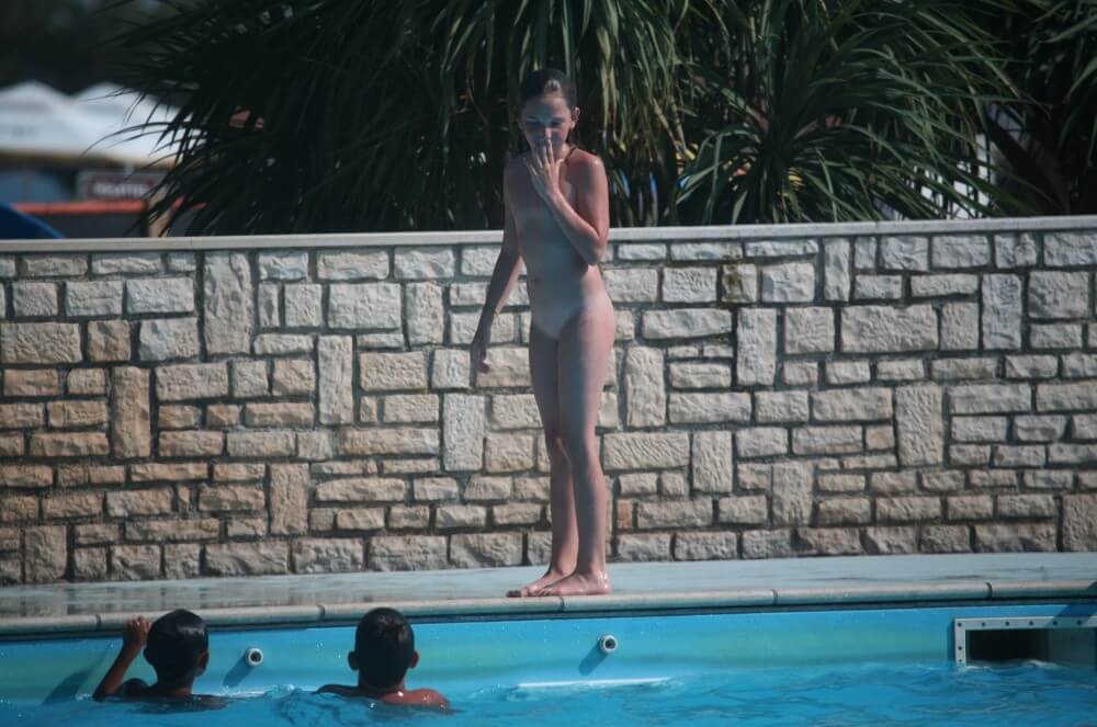 Naturist Pool-Side Singles photos - Taking Off Ones Clothes