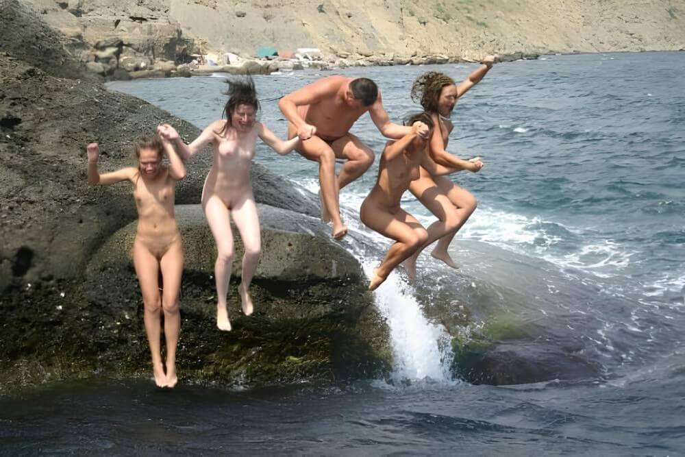 Mens and girls nudists on a beach - The first step toward home nudism