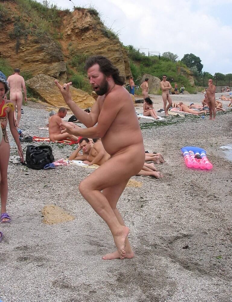 Afternoon Beach Delight pics - A defining feature of naturism is the absence of clothing