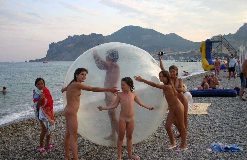 Pics Walk on the Beach Balloon - People seek unity with nature through naturist practices